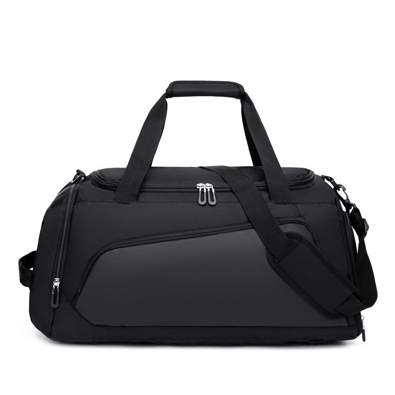 Black duffel bag with shoulder strap on a white background
