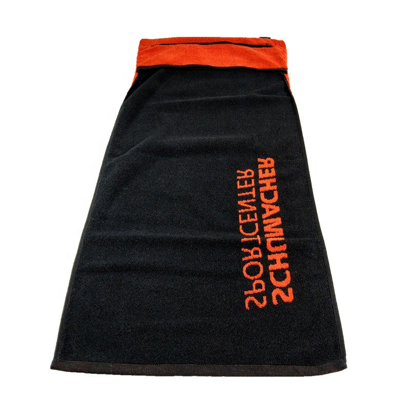 Black towel with orange interior and text on a white background